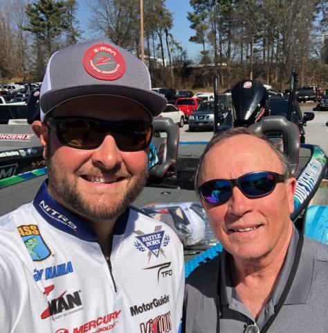 Local fisherman and Bassmaster Classic marshal David McGinnis, right, with his new friend and rising star angler Joey Nania.