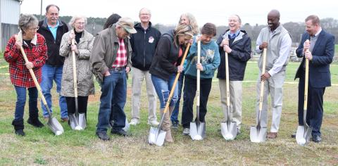 Northeast Georgia Animal Shelter board members, staff and supporters celebrate the groundbreaking for its new building Thursday afternoon.  
