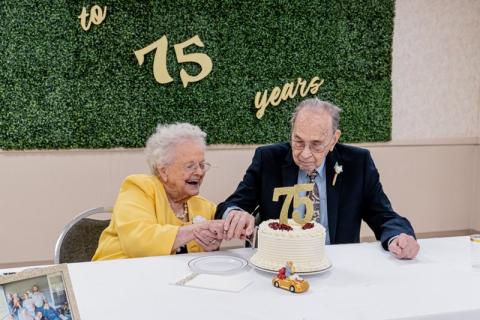 Jean and Albert Maxwell cut the cake together on Saturday in celebration of their 75th anniversary.