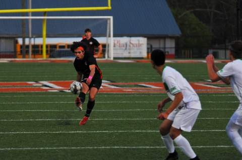 Tyler Trujillo curves his shot around the wall to score a goal off a free kick in the win over Franklin County on March 25.