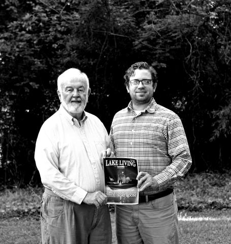 Award-winning photographer Bill Powell, left, stands alongside The Hartwell Sun publisher Dan Hunt and a print of his Lake Living cover shot.