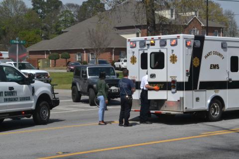 Hartwell EMS checks on a pedestrian in the back of ambulance who was allegedly struck by a car minutes earlier on Tuesday afternoon, April 12. 