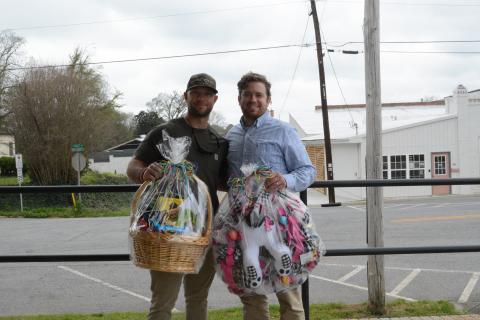 Paul Mitchell, left, displays his Golden Egg Hunt prize winnings alongside The Hartwell Sun publisher/editor Dan Hunt. 