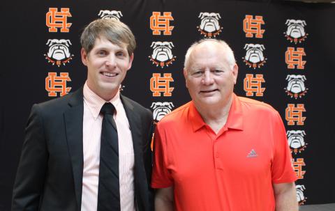 New head basketball coach Matt Gibbs (left) poses next to the now retired Harry Marsh.