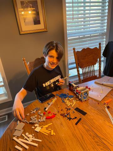 Jackson Ford lays out the pieces of his Titanic model in the initial phase.
