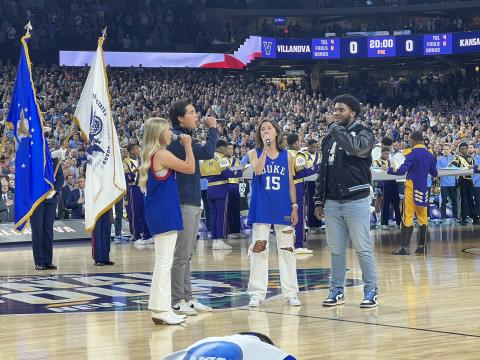 Former Hart County High School student athlete and current North Carolina Tar Heel linebacker Kaimon Rucker (far right) joins his peers from Duke University, Villanova University and Kansas University in a rendition of the national anthem before the men’s basketball Final Four in New Orleans on Saturday.  