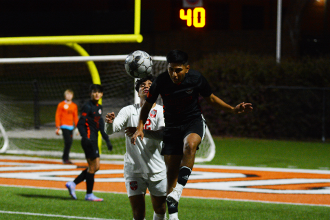 Drew Dotson/ The Hartwell Sun - Jonathan Gench-Cortez heads the ball away from the Madison County attacker on Thursday, April 7.