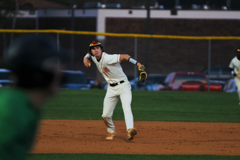 Zach Dombrosky attempts to throw a Franklin County runner out at first.