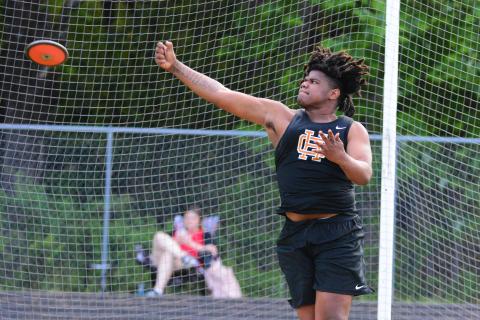 Kanye Fouch sets a school record with a 155-08 discus throw. 
