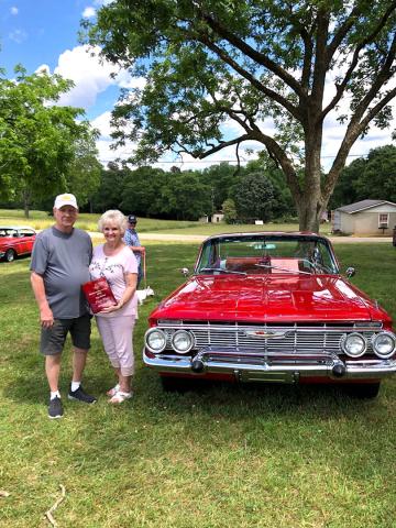 Sammy Bowers and his first place-finishing 1961 Chevy Impala.