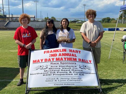 Pictured are crew members Brody McDuffie, Aimee Aguilar, Gelsey Aguilar (driver), and Duncan McDuffie (crew chief).