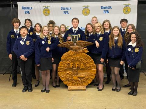(Pictured, from left to right, are Ashlyn’s father, Brandon Floyd, Ashlyn Floyd, Ashlyn’s mother, Rebecca Floyd, and her brother, Austin Floyd.) Pictured bottom right, Rachel Mize (left), Piper Bond (center) and Ashlyn Stanton (right) all three received their FFA State Degree. This is the highest degree an FFA member can earn while in high school.