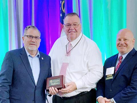 Superintendent Floyd with his award alongside Rob Brown, right, and GSSA Executive Director, left. 