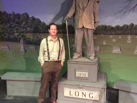 Hartwell playwrite Michael Blackston alongside the prop statue and subject of his original production, “Mr. Long said Nothing.” Blackton’s play, performed by the Hart County Community Theatre, will be available to audiences starting May 13 and run four more nights through May 22.  