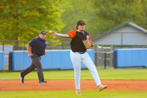 Dean attempts to throw a runner out at first base against Ringgold on April 29.