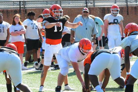 Senior quarterback Austen Whitworth directs the offense during a run drill at practice on May 12.