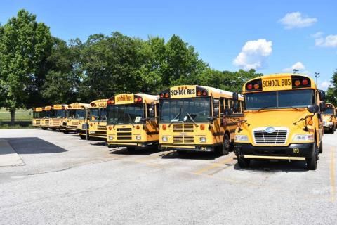 Dawson Baker/The Hartwell Sun - A row of buses sits idle adjacent to Hart County High School. School officials say the school district was spending as much $9,200 on gas per week by the end of the school year.