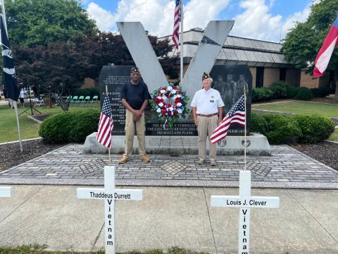 Josh Brannen/The Hartwell Sun - Vietnam veterans Thomas Morrison, left, and Bruce Jones, right, place the Memorial Day wreath at Veterans Memorial Park to honor Hart County men who sacrificed themselves in combat. 