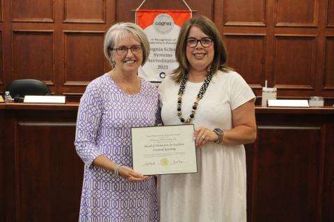 Finance director Donna Jones, left, was among those recognized for excellence in financial reporting. Board Chair Kim Pierce is pictured right. 