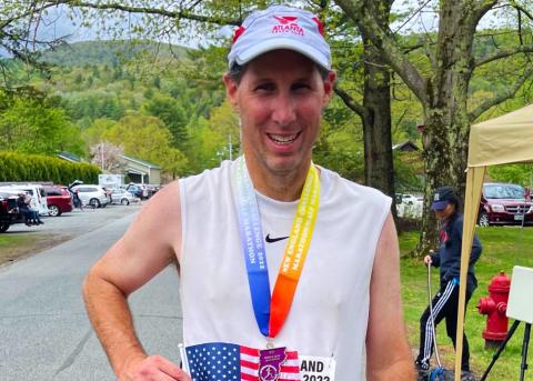 A proud Dr. Wade Walker grins after completing his mission of 50 marathons in 50 states. Walker finished his quest in Vermont on May 15.