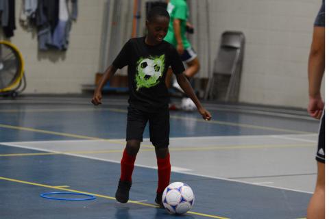 Kingston Durham practices his ball handling skills in the YMCA gym.