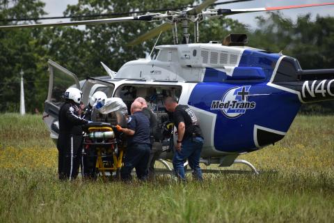 EMS carefully loads burn victim Grayson Webb into an emergency helicopter Tuesday. 