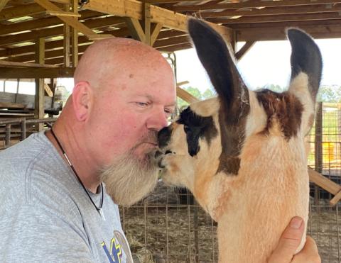 Georgette gives Liam Munore a velvety thank-you kiss for her new, cooler summer haircut.