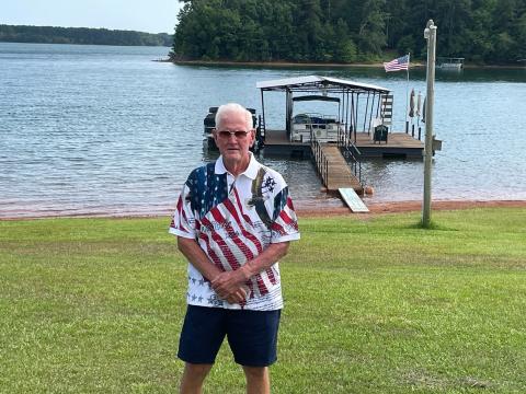Hartwell staple Vinson Brown stands in front of his pristine lake front property in Hartwell. 