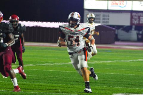 Peyton Powell looks for a block down field against Westside last season.  