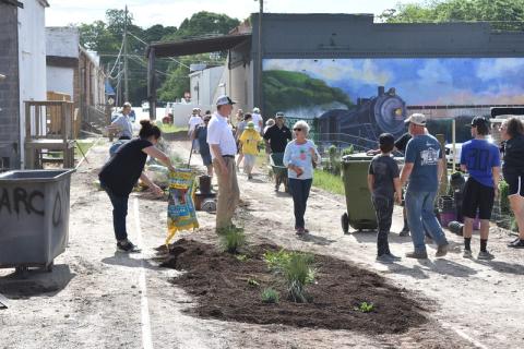 Residents turned out to help install plants in a new garden, part of a downtown streetscape in Hartwell, designed by UGA engineering students.