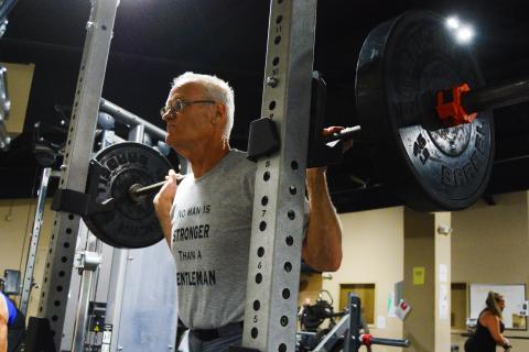 David Leard shows off his squat technique that allowed him to set a state record. 