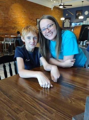 Kaden Phillips and volunteer Gracie Howington hang out at Center Field in downtown Royston.