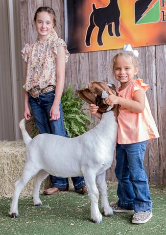 Kylie Ruff (10), Emerson Cabe (4) with Peppa Pig, the goat. 