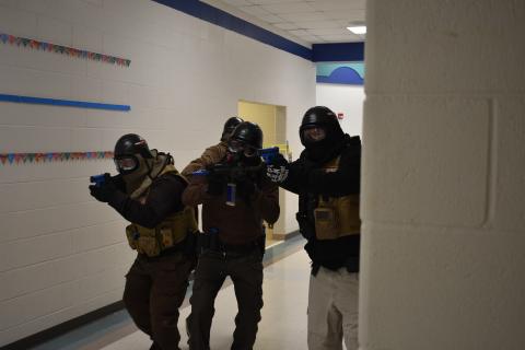 The active shooter training team simulates an active shooter situation. Pictured above, the “good guys” in one of the scenarios.