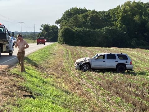 The driver in a single-car accident Tuesday along Lavonia Highway walks from his car uninjured. 