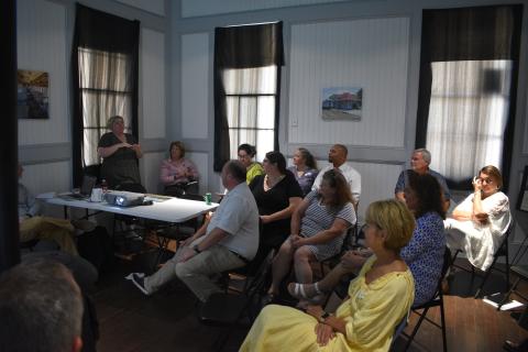 Several community members attend a meeting with the National Main Street program on Wednesday, Aug. 10 at the Hartwell Train Depot.  