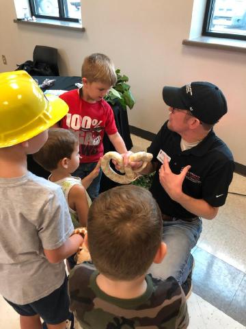 Dr. Nick Furhman shows off Snowy the corn snake to specators at the Northeast Georgia Ag Expo. 