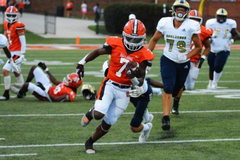 Running back Nori Moore breaks through a tackle for a big run against Apalachee in Hart’s first home game on Friday, Sept. 2.