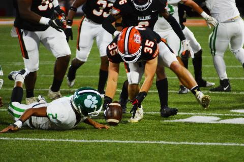 Cyrus Bowen scoops up a fumble on Franklin County’s first offensive possession.