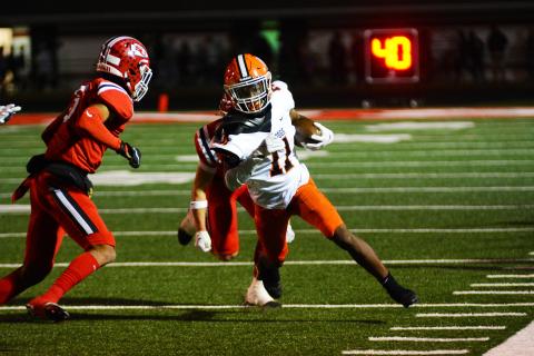 Keith Curry turns up field after catching a pass against Stephens County.