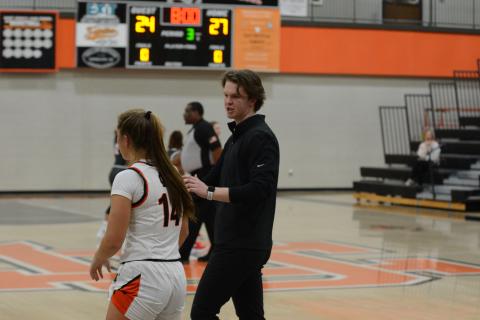 Pictured right, Ben Edwards coaches up junior guard Dakota Phillips in the Madison County win on Nov. 10.