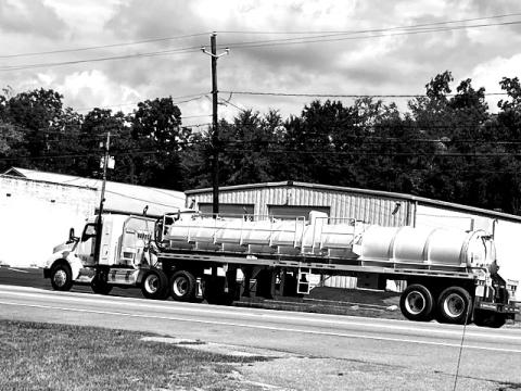 A big-rig-tanker load of industrial waste, aka soil amendment or sludge, sits along the roadside in Lexington.