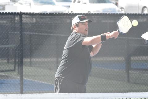 Kevin Geraty returns a serve in his doubles match at the Fall Freedom Pickleball Classic held in Hartwell on Friday, Nov, 4.