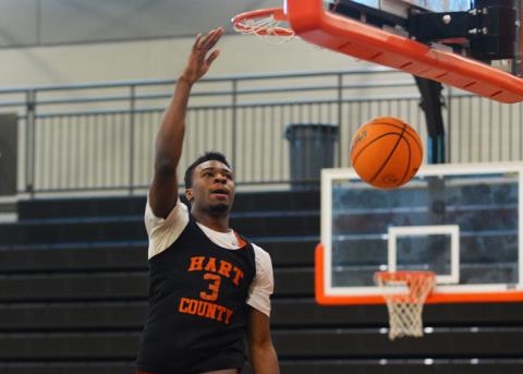 Senior Tahj Johnson finishes at the rim during practice on Nov. 1. 