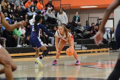 Junior guard Dakota Phillips guarded closely by a Lady Blue Devil in the home loss to rival Elbert County, 82-51.