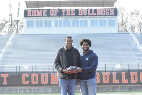 University of North Carolina defensive end Kaimon Rucker, a former Hart County standout, shares a commemorative football with Ramsey Gaines, 16, who recently received news that he is cancer-free. Rucker dedicated his team’s Oct. 1 win over Virginia Tech to Gaines, a junior at Hart County High School.