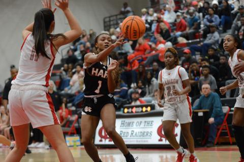Senior guard Valasha Carter dishes it to an open teammate in the Lady Dogs close win at Madison County on Dec. 10.
