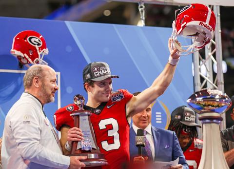 From a walk-on quarterback to a Heisman finalist, Stetson Bennett has already had a legendary UGA career. Leading the Bulldogs to a come-from-behind victory over Ohio State’s Buckeyes in the New Year’s Eve Peach Bowl, No. 13 was honored as the Most Valuable Player (MVP) on offensive. Making the presentation was Chick-fil-A Peach Bowl president and CEO Gary Stokan. Counting last year’s semifinal and national championship games—plus the SEC championship game—that makes four times the six-year senior has been 