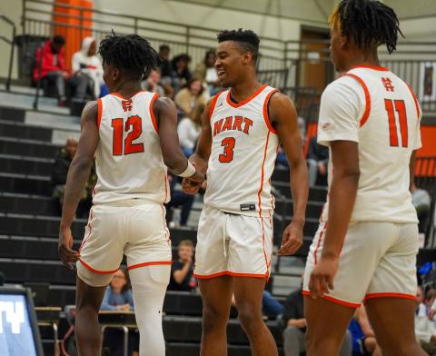 Pictured left to right: senior Terrance Mitchell, senior Tahj Johnson, and junior Jashon Gaines celebrating the 68-55 home win over the Warriors of Oconee County on Friday, Jan. 19. (Photo by Lexie Wheless)
