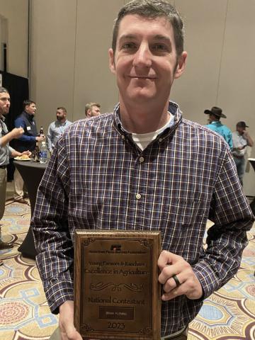 Brian Fleming, left, won the 2022 Georgia Farm Bureau Young Farmers & Ranchers Excellence in Agriculture Award.